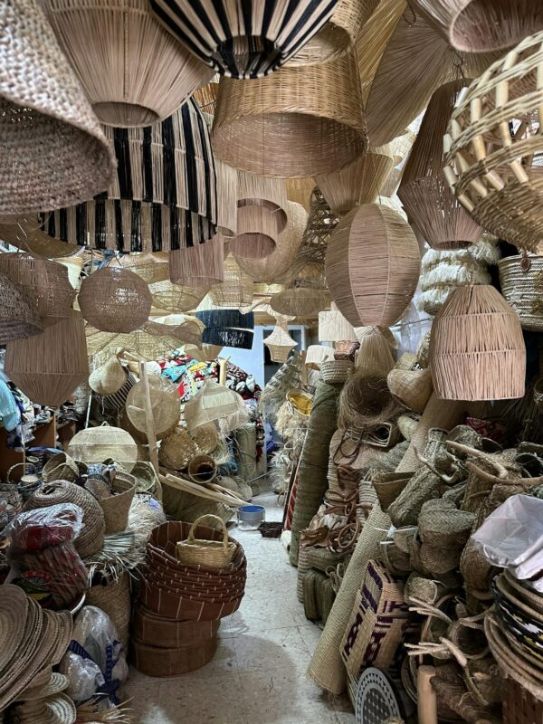 A captivating display of handmade wicker and rattan items in a traditional craft store. Explore the artistry.