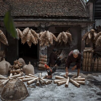 Man with Straw Baskets on a Street